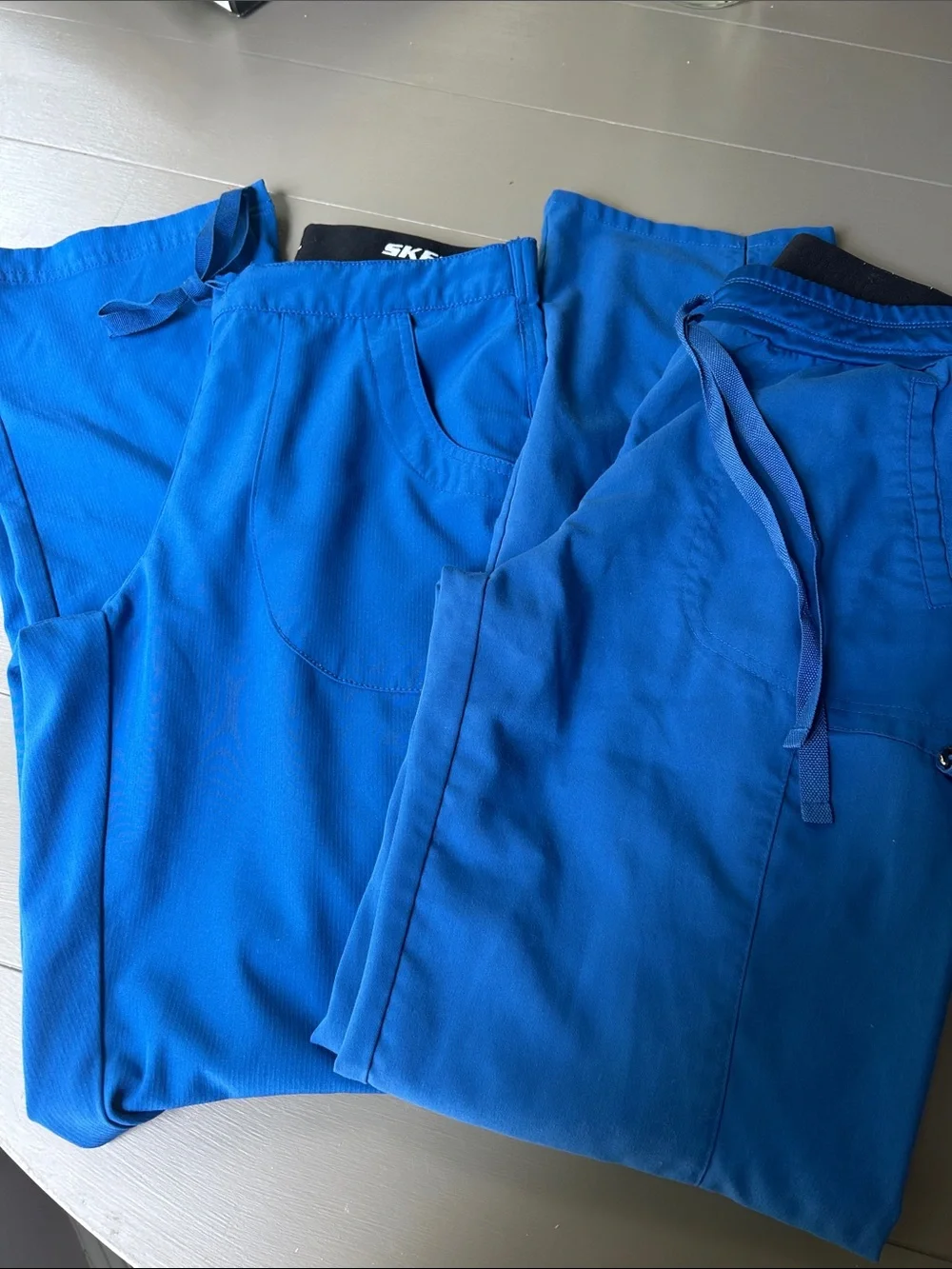 Bundle of royal blue nursing scrubs